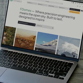 fdomes website displayed on laptop screen